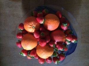Delicious oranges and strawberries