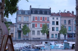 Boats at the Wharf and pretty houses on the other bank